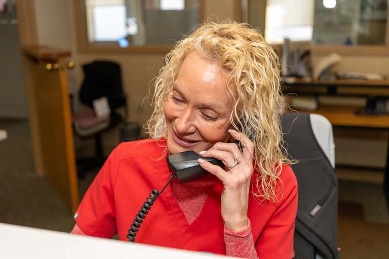 The friendly female staff member answering the phone at Family Dental Practice in Kokomo IN.