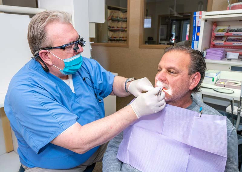 Dr. Kevin Welch with a patient in the exam room at Family Dental Practice in Kokomo IN.