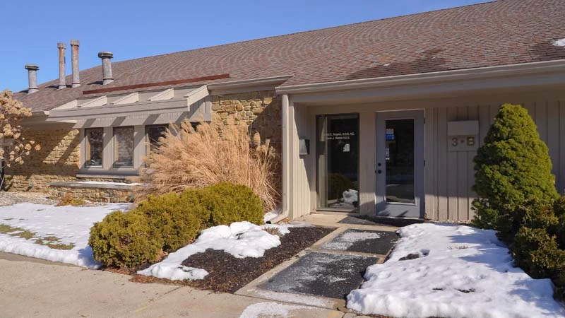 An outdoor photo with snow on the ground at the offices of Family Dental Practice in Kokomo IN.