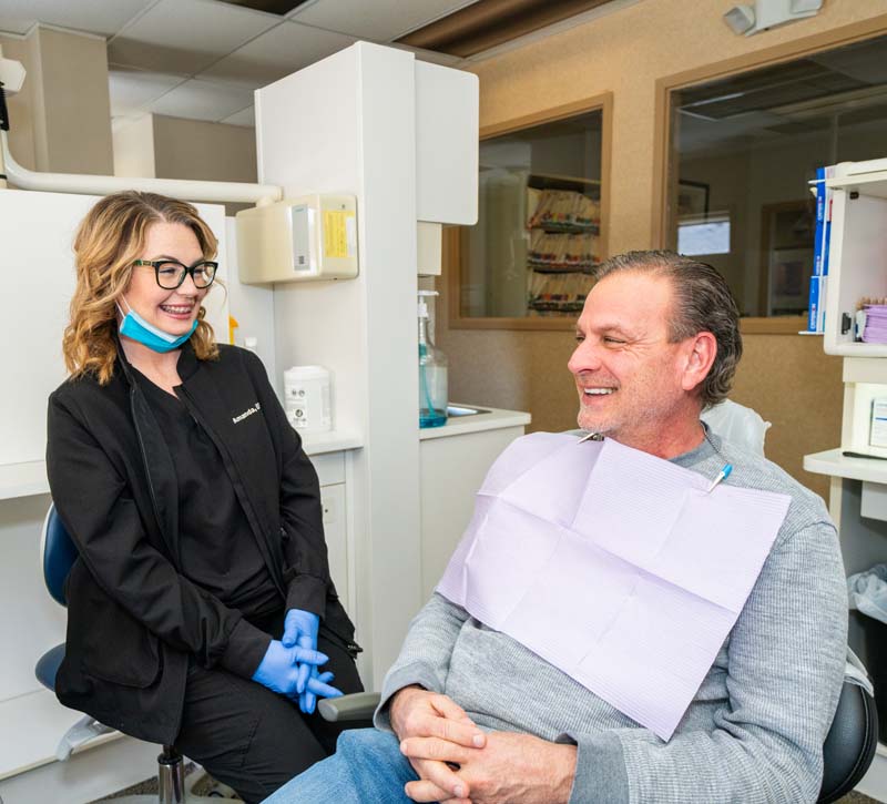 Staff member with a patient discussing preventative dental procedures at Family Dental Practice in Kokomo IN. 
