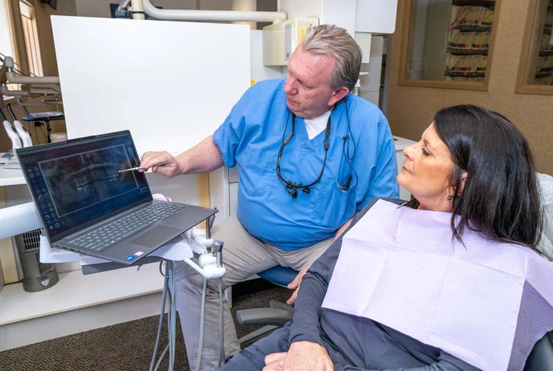 Doctor with a patient discussing restorative dental options at Family Dental Practice in Kokomo IN.