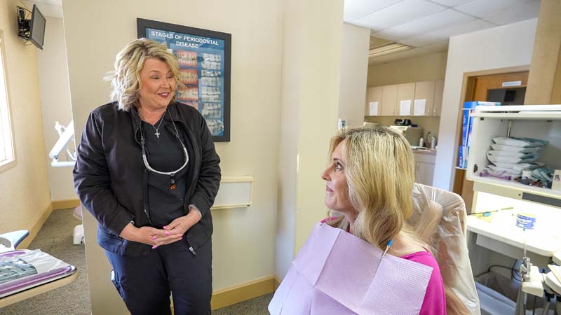 A female patient discussing root canal options with a staff member at Family Dental Practice in Kokomo IN. 
