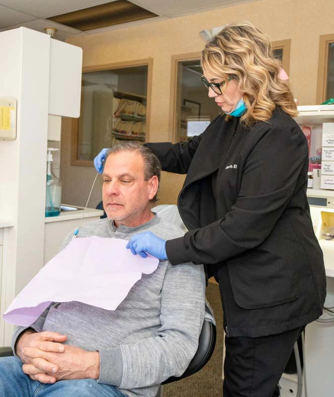 A male patient discussing sedation options with a staff member at Family Dental Practice in Kokomo IN.
